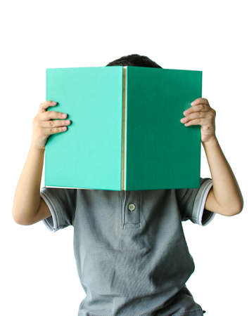 Cute little boy reading a book on white backgroundの写真素材