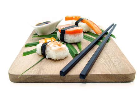 Different types of sushi in the plate isolated on white backgroundの写真素材