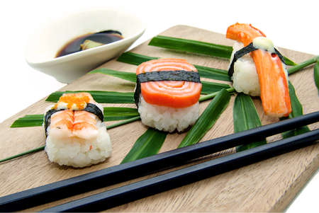 Different types of sushi in the plate isolated on white backgroundの写真素材