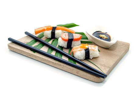 Different types of sushi in the plate isolated on white backgroundの写真素材