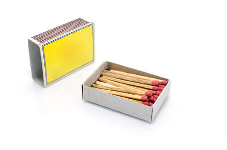 Matches in a matchbox on a white background with copy space の写真素材