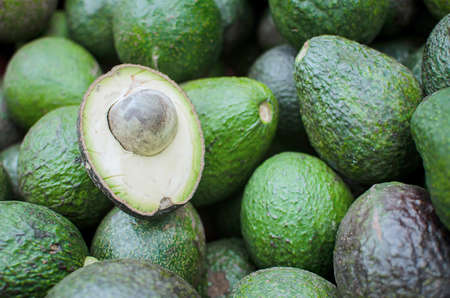 A sliced avocado on a cuttingの写真素材