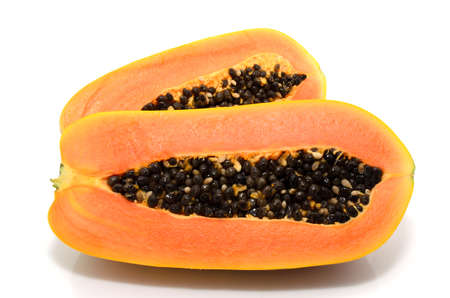 Half cut and whole papaya fruits on white backgroundの写真素材