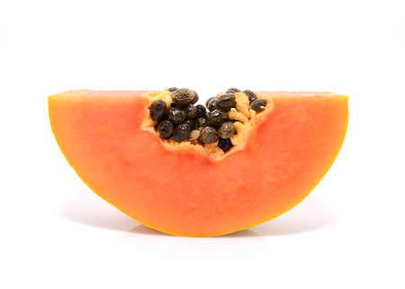 Half cut and whole papaya fruits on white backgroundの写真素材