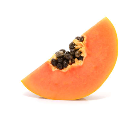 Half cut and whole papaya fruits on white backgroundの写真素材