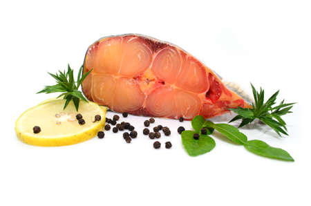 prepared pangasius fish fillet pieces and spicesの写真素材
