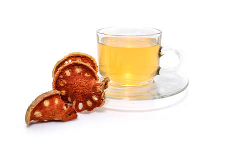 a cup of hot bael fruit juice on white backgroundの写真素材