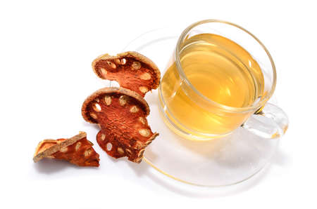 a cup of hot bael fruit juice on white の写真素材