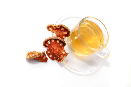 a cup of hot bael fruit juice on white の写真素材