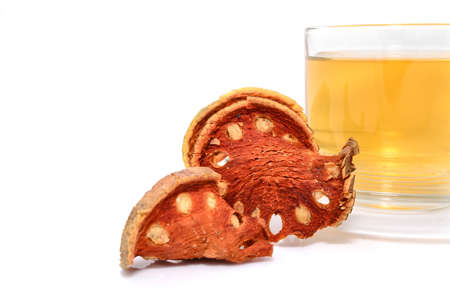 a cup of hot bael fruit juice on white の写真素材
