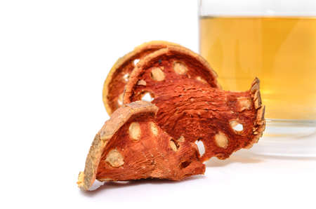 a cup of hot bael fruit juice on white の写真素材