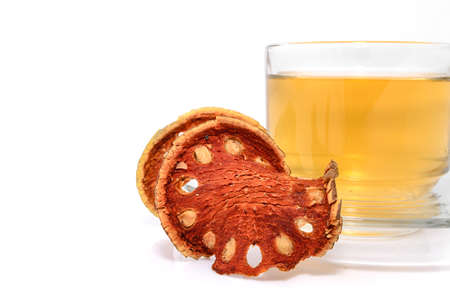 a cup of hot bael fruit juice on white の写真素材