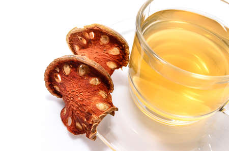 a cup of hot bael fruit juice on white の写真素材