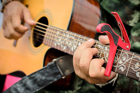 Man playing guitar, Close up shot.