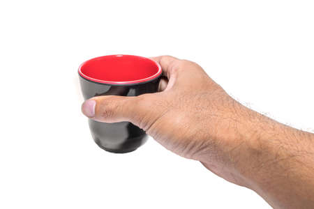 black cup in his hands. Isolated on white backgroundの写真素材