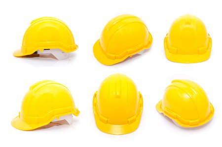 Yellow safety helmet isolate on white backgroundの写真素材