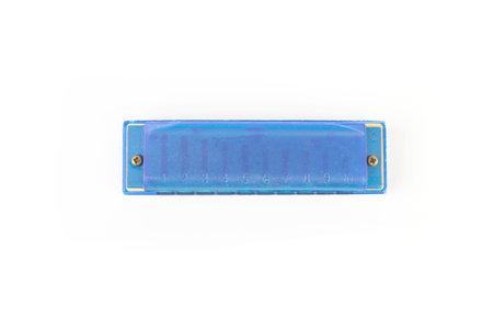 One blue harmonica on a white background