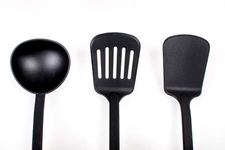 black kitchen utensils isolated on whiteの写真素材