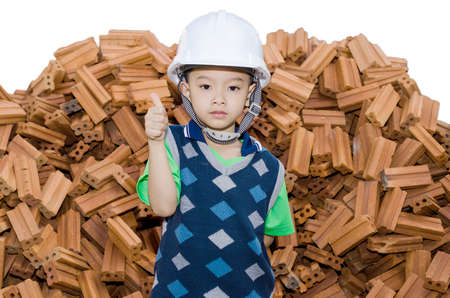 Boy pretending to be a construction workerの写真素材