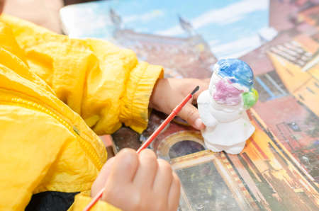 Close Up paint white statue with paintbrushの写真素材
