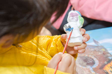 Close Up paint white statue with paintbrushの写真素材