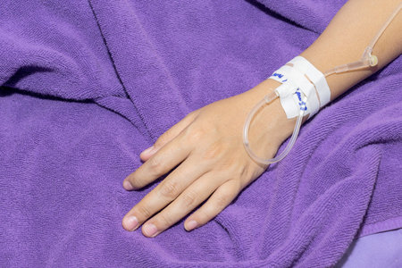 Close up of patient in hospital with saline intravenous