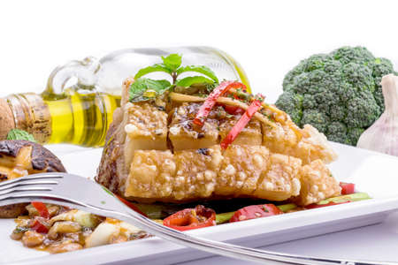 Honey roasted pork on white background.の写真素材