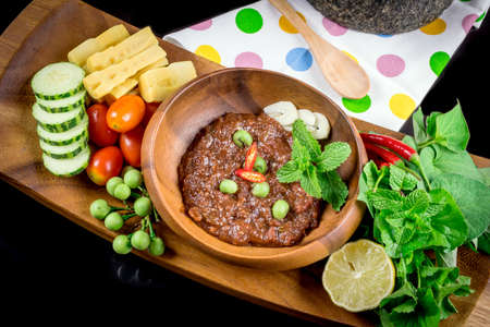 Thai cuisine nam prik or chili paste mixes with fish serves with various vegetablesの写真素材