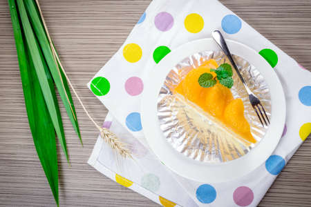Orange cake on a  tableの写真素材