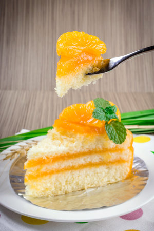 Orange cake on a  tableの写真素材