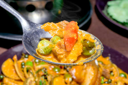 Hot and spicy with fried pork mixed with eggplant leaf very famous of Thai foodの写真素材