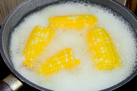 corn boiling in pot, Corn Boil hot water.の写真素材
