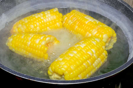 corn boiling in pot, Corn Boil hot water.の写真素材