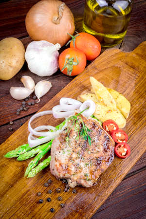 Grilled steak meat with salad from baked pepperの写真素材