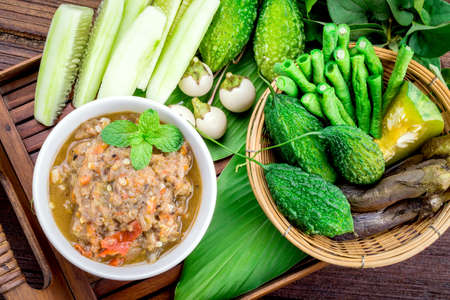 Thai cuisine nam prik or chili paste mixes with fish serves with various vegetablesの写真素材