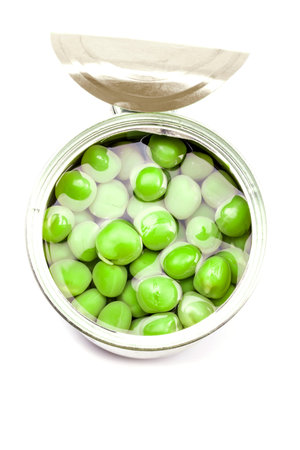 Opened tin with green peas. Isolated on white.の写真素材