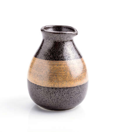 Japanese sake cup and bottle on white backgroundの写真素材