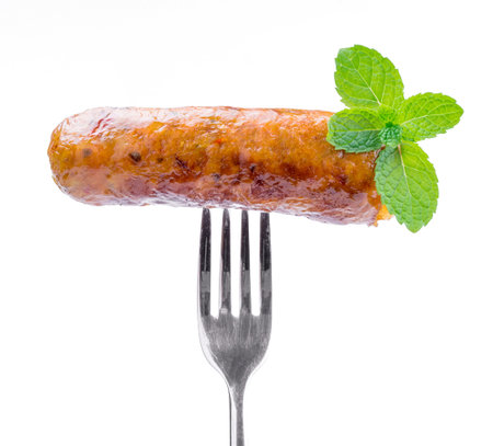 smoked sausage against on white background, Local cuisine of northern Thailand (Sai Oua).の写真素材