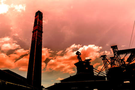 industry silhouettes as against a background of red sunset skyの写真素材