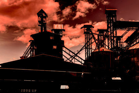 industry silhouettes as against a background of red sunset skyの写真素材