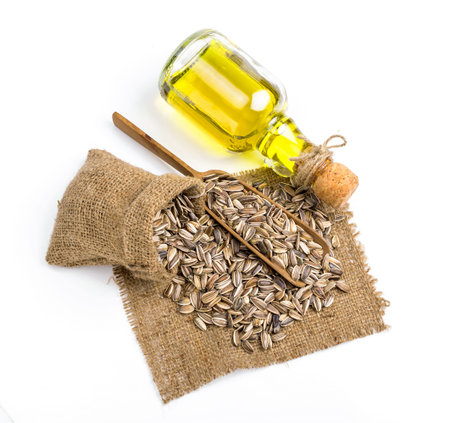 sunflower seed oil isolated on white backgroundの写真素材