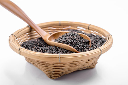 black sesame in the wooden spoonの写真素材