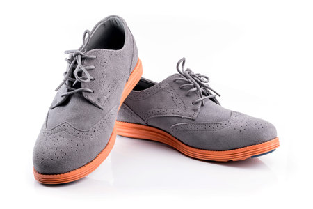 Close-up of elegant mens shoes on white backgroundの写真素材