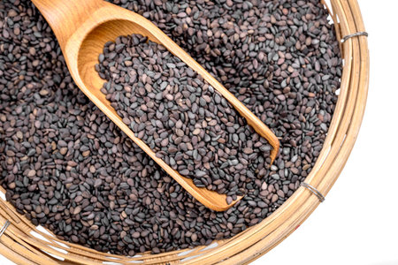 black sesame in the wooden spoonの写真素材