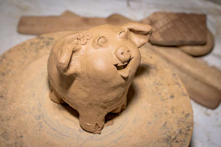 manufacture of ceramic vessel hands of the child and adult, Household pottery rural north of Thailand.の写真素材