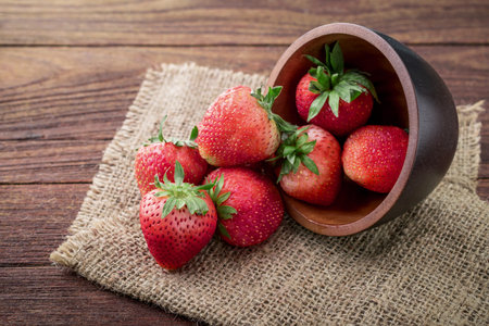 Fresh strawberries on old wooden backgroundの写真素材