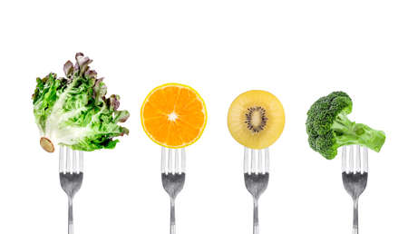 vegetables and fruits on fork isolated on white backgroundの写真素材