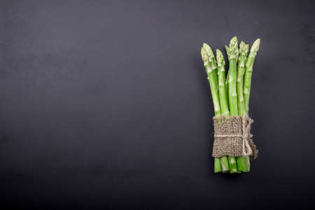 Bunch of asparagus over slate backgroundの写真素材