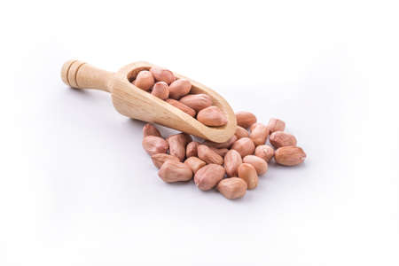 Basket full with peanuts. Isolated on a white background.の写真素材