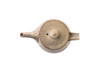 Japanese teapot of clay on white background.の写真素材